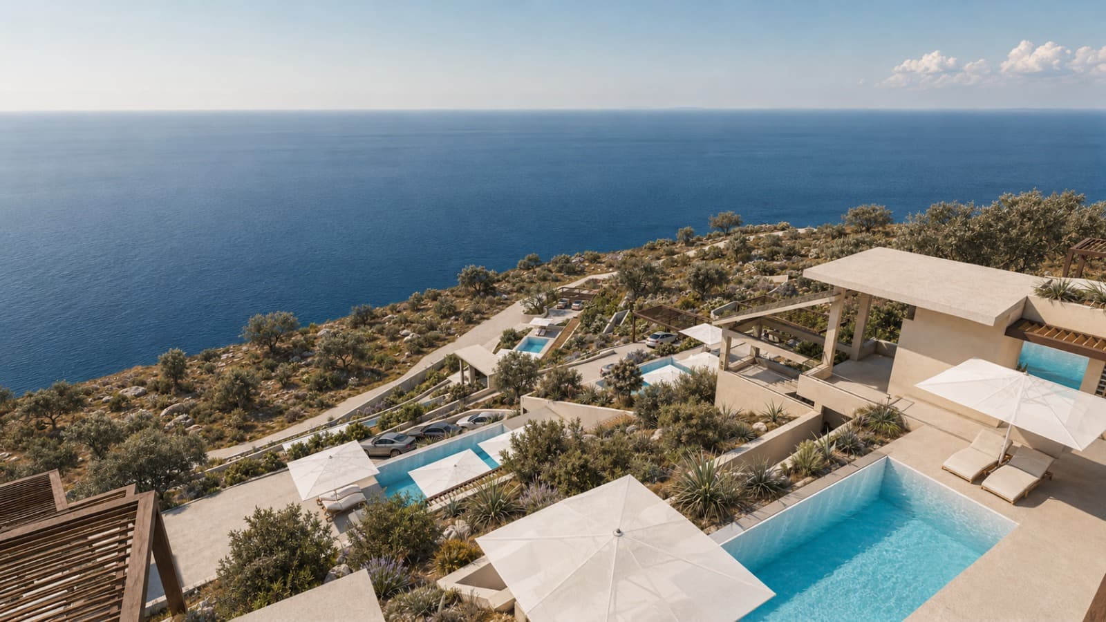 Two of the villas with their pools, above the open sea.