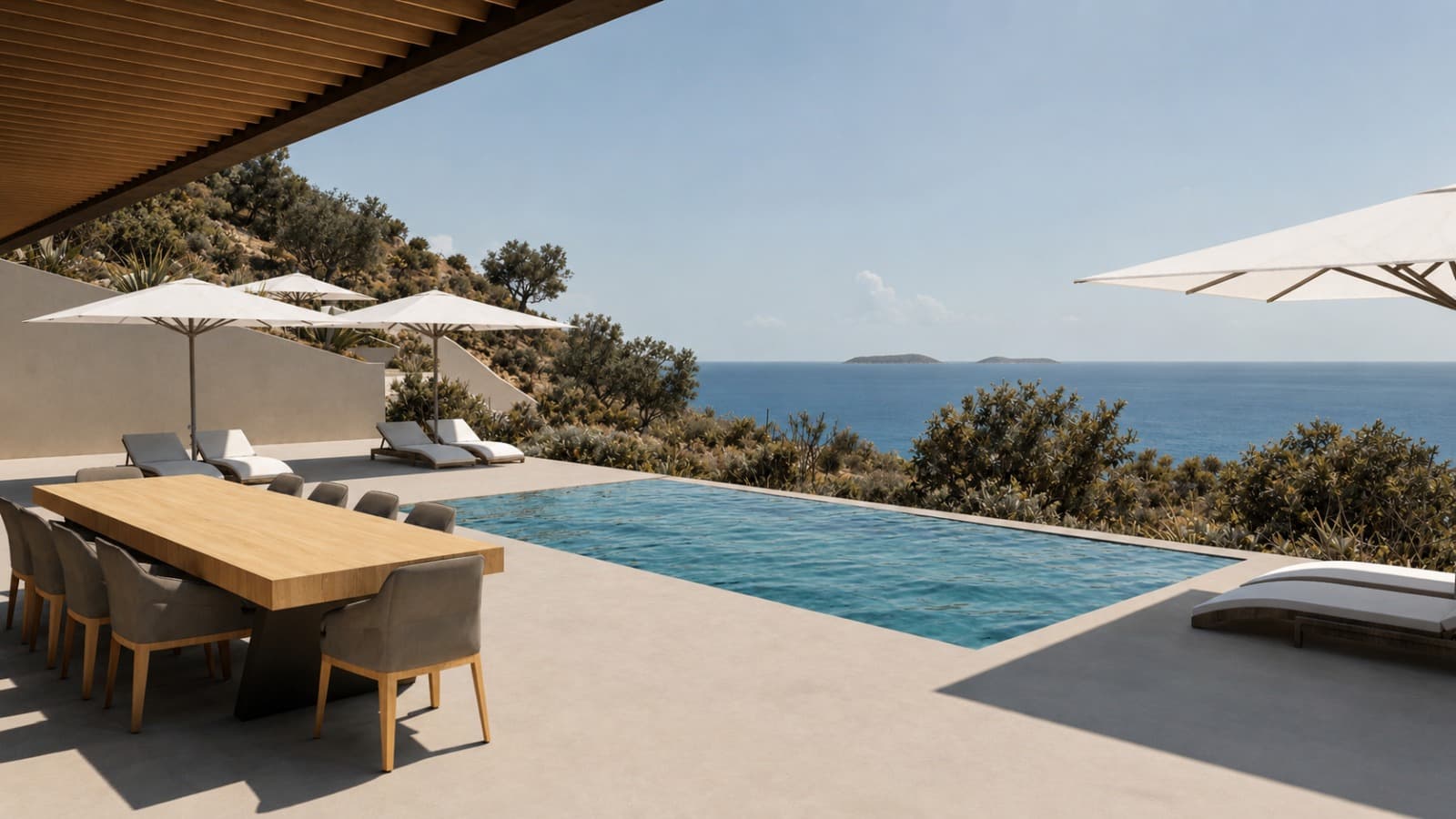 The dining terrace under its roof, beside the pool and the open sea.