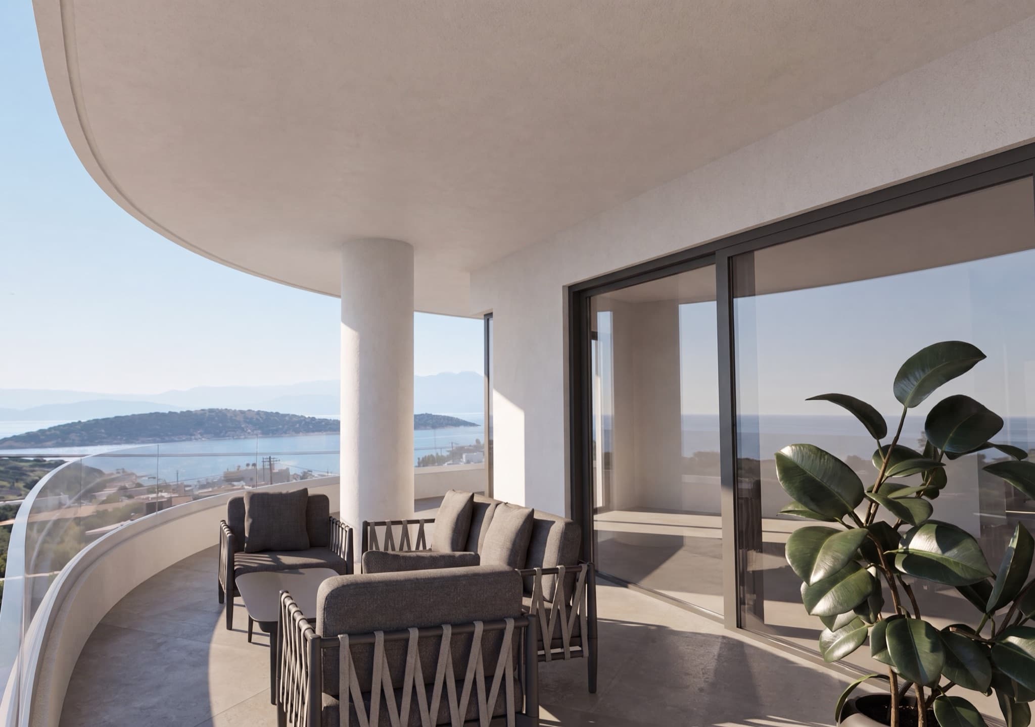 The curved balcony of one of the apartments, above the bay.