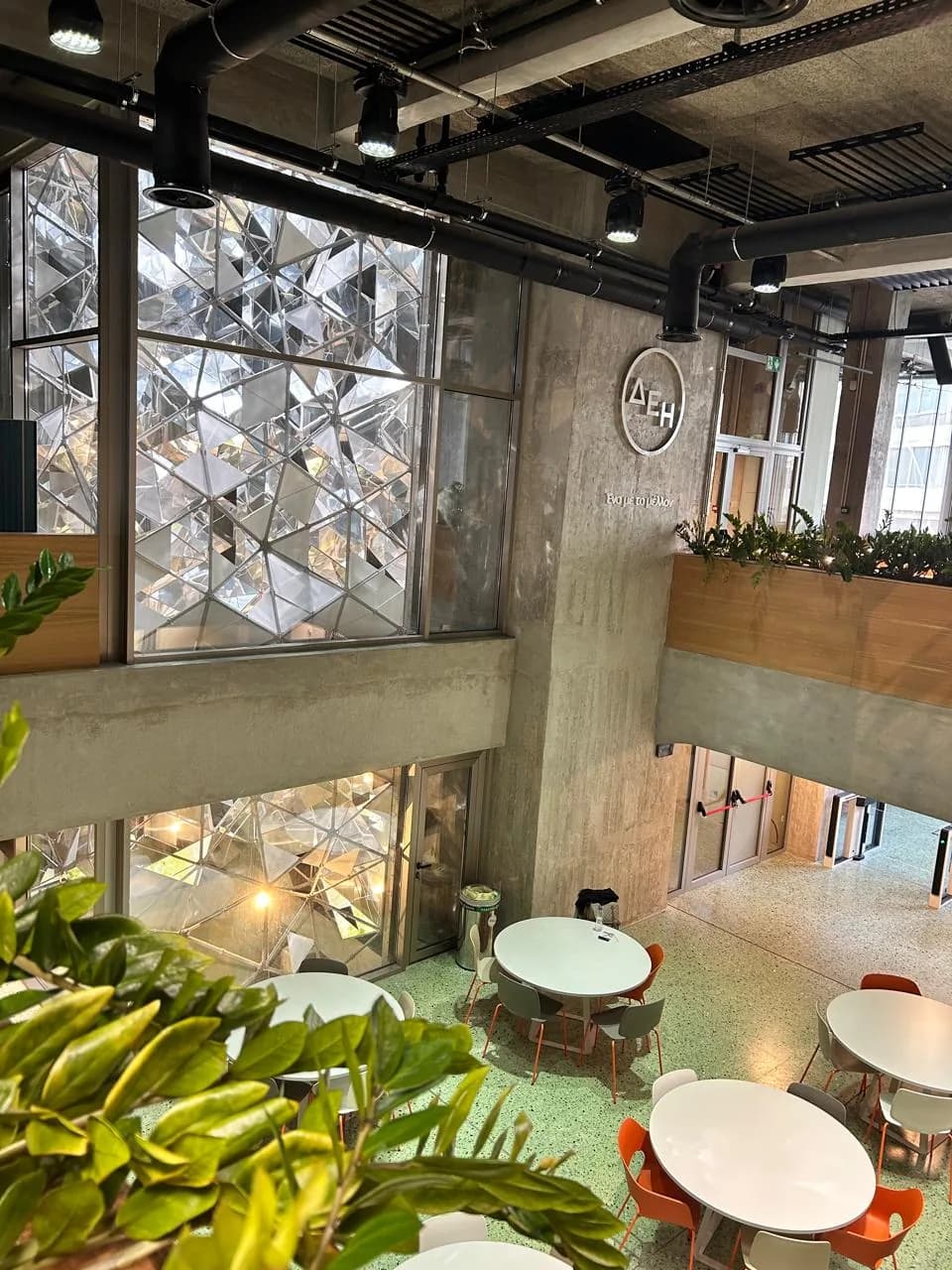 Looking down the atrium to the café tables on the floor below.