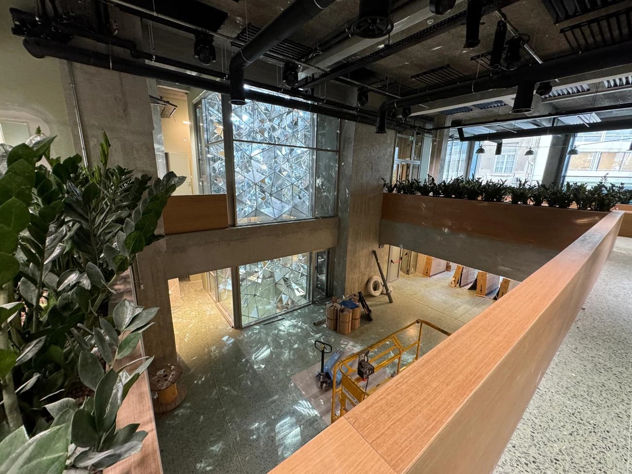 The atrium, walled in faceted mirrored glass.